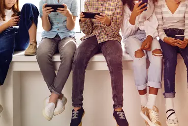 Children looking at phones
