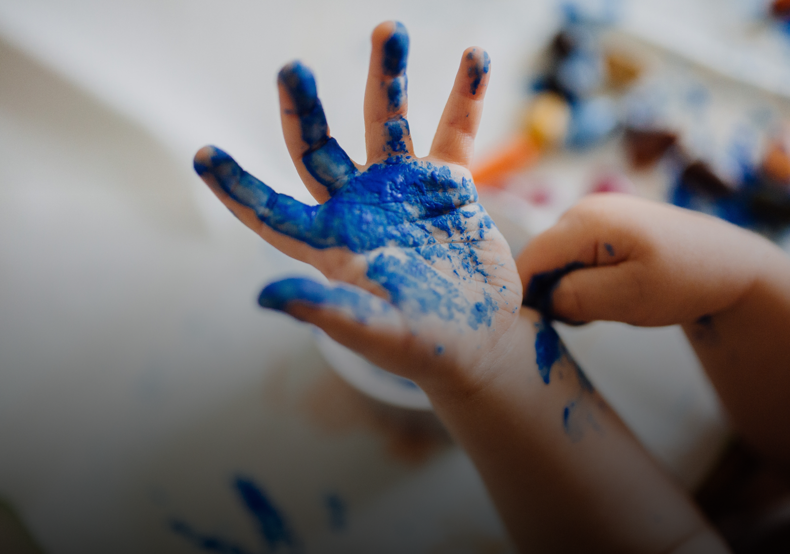 Child with painted hands