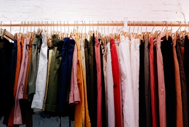 Clothes on hangars on a rail