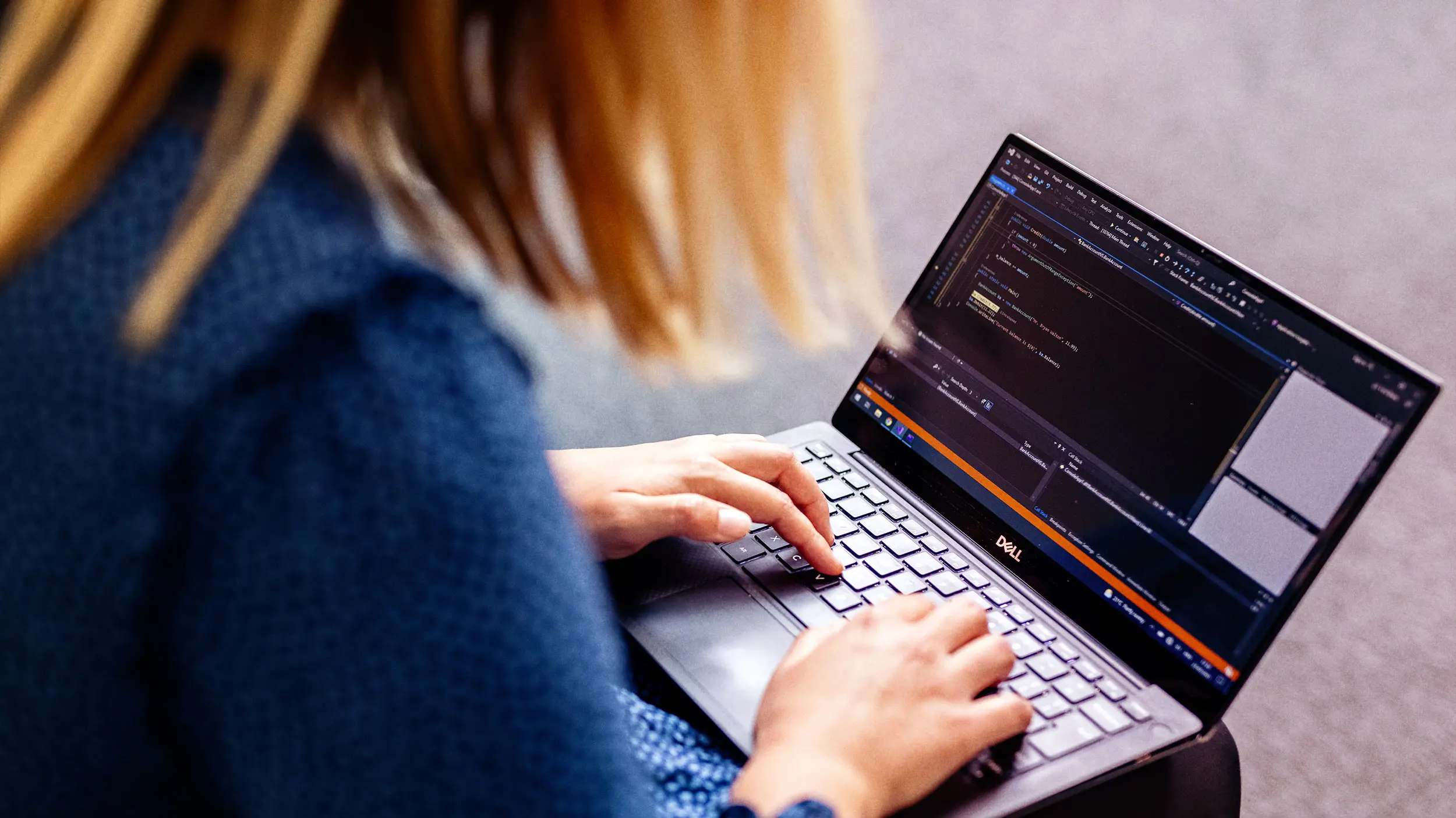 Coder working on laptop