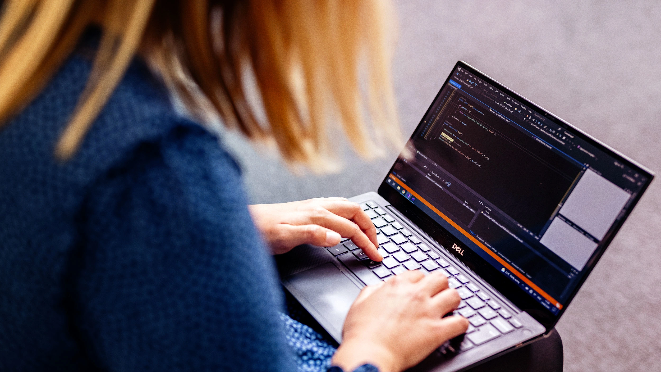 Coder working on laptop