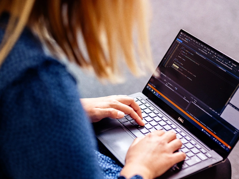 Woman typing on laptop