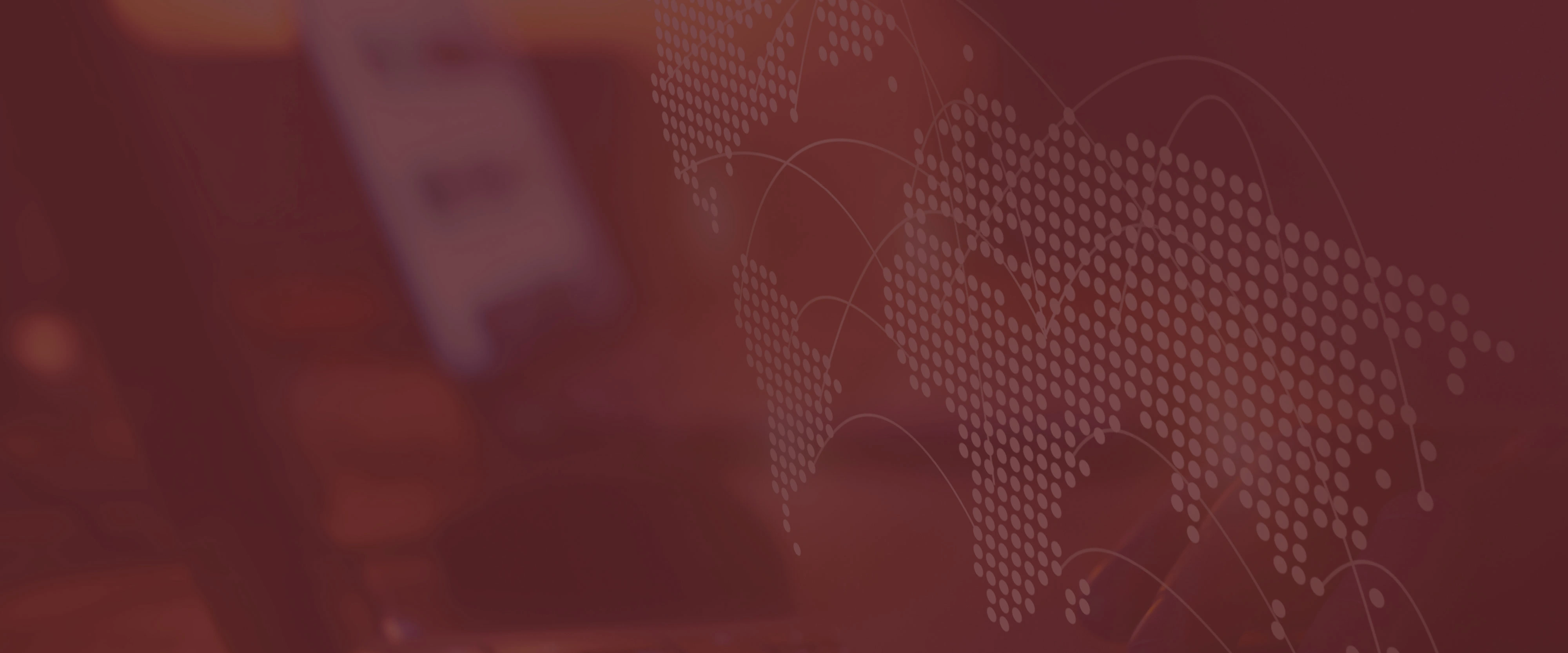 Map showing the world represented as dots with a computer in the background