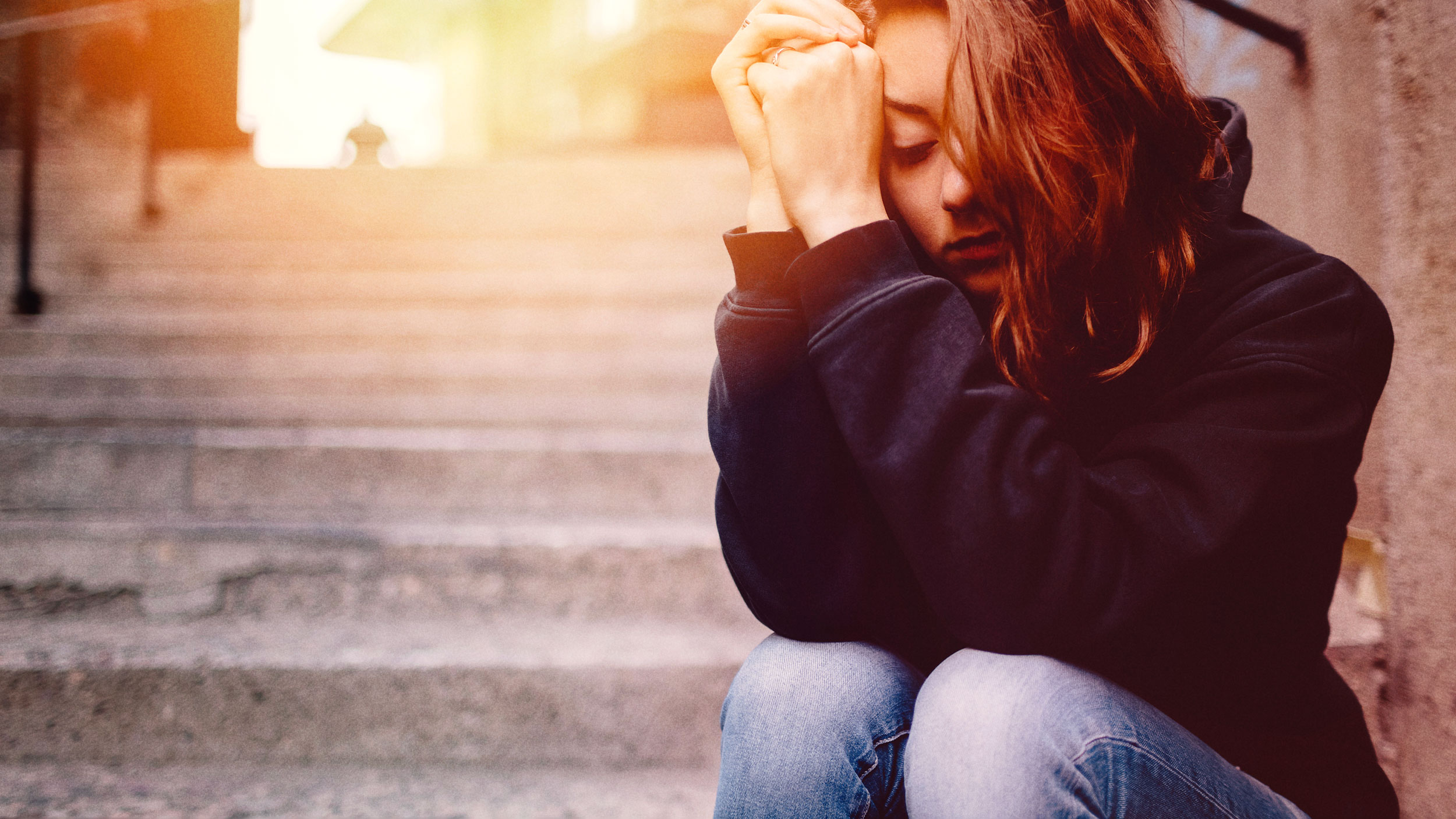 Girl looking out of window
