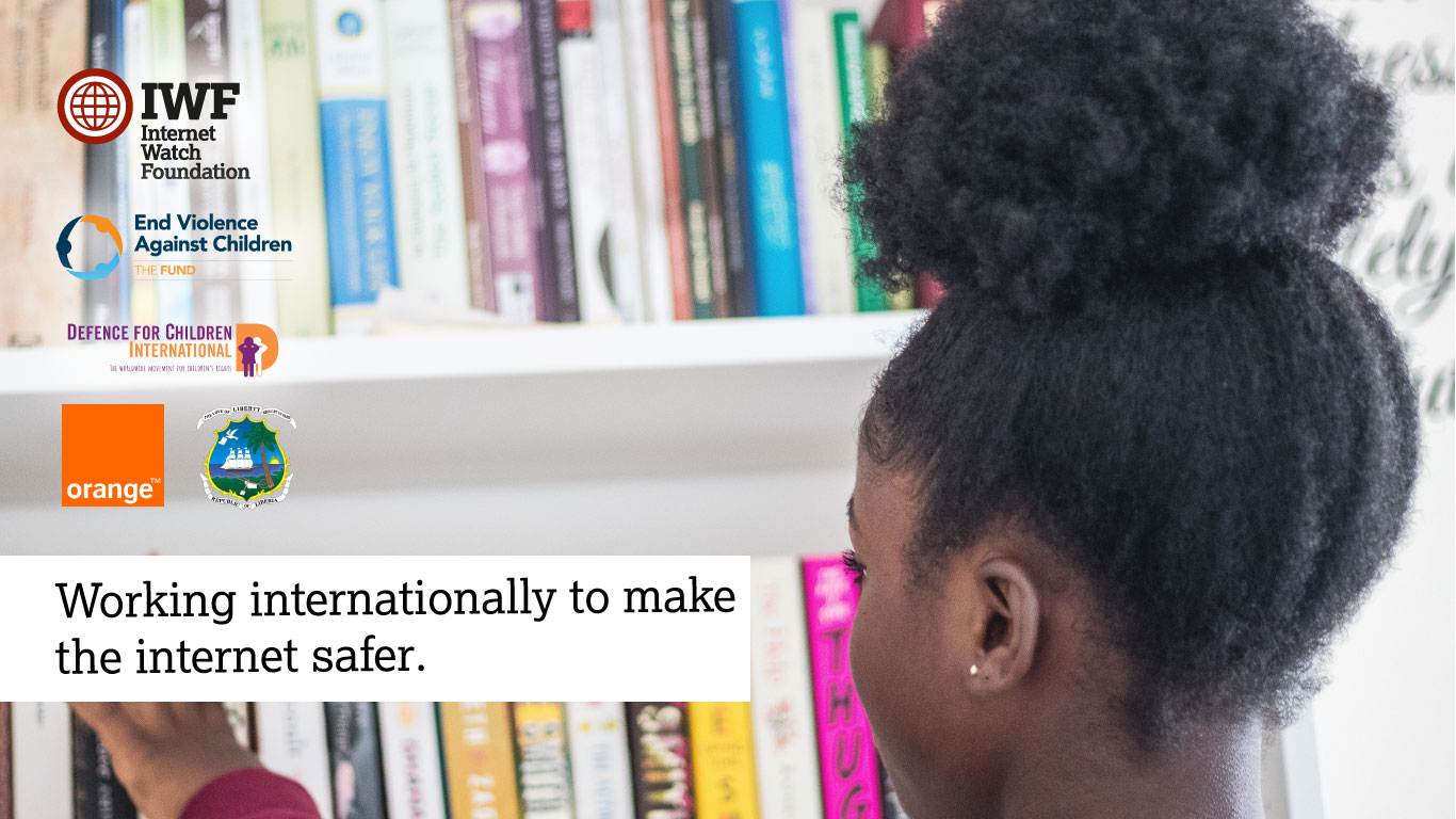 Child in front of bookshelves