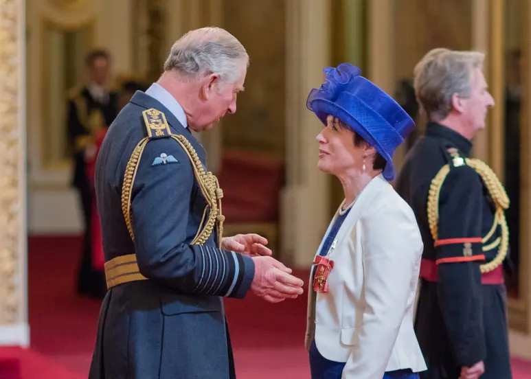 Woman receiveing award
