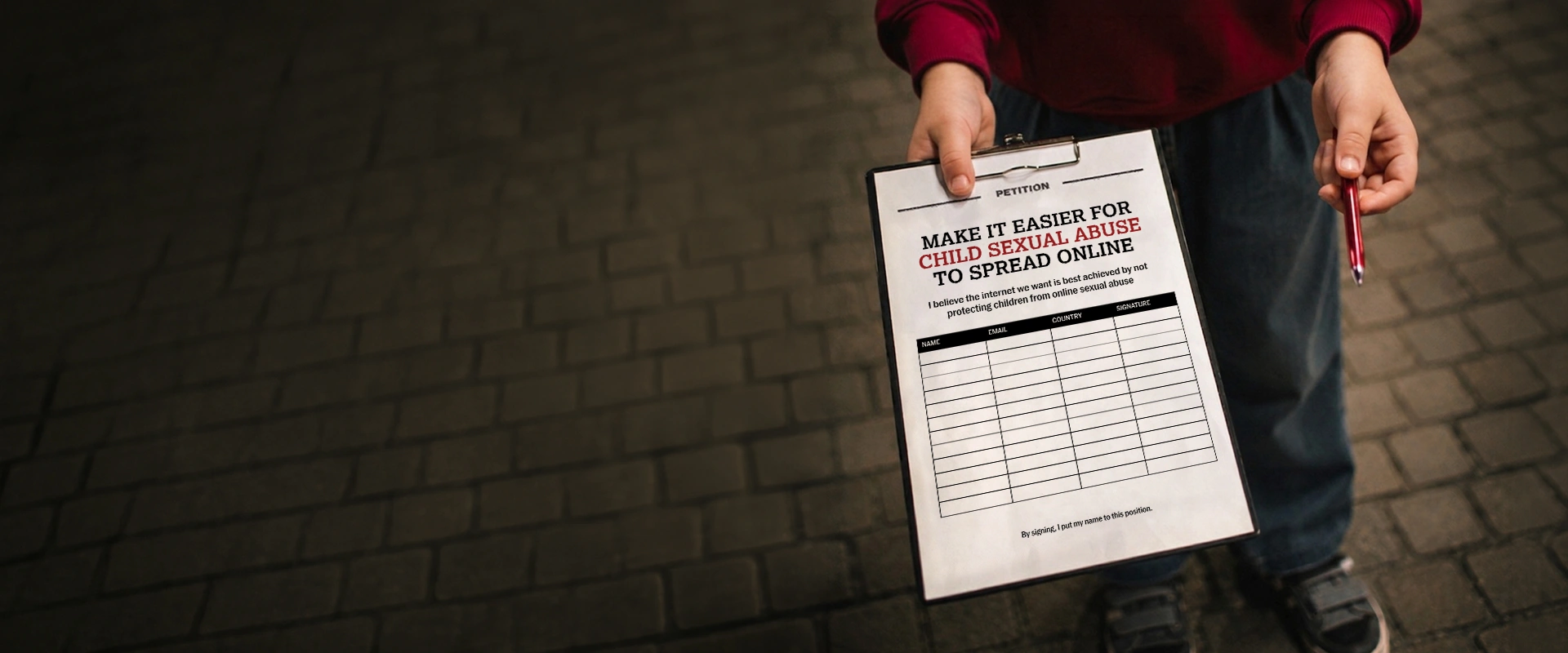 A person holds out a clipboard with a mock petition titled 'Make it easier for child sexual abuse to spread online,' with a pen extended toward the viewer, inviting a signature.