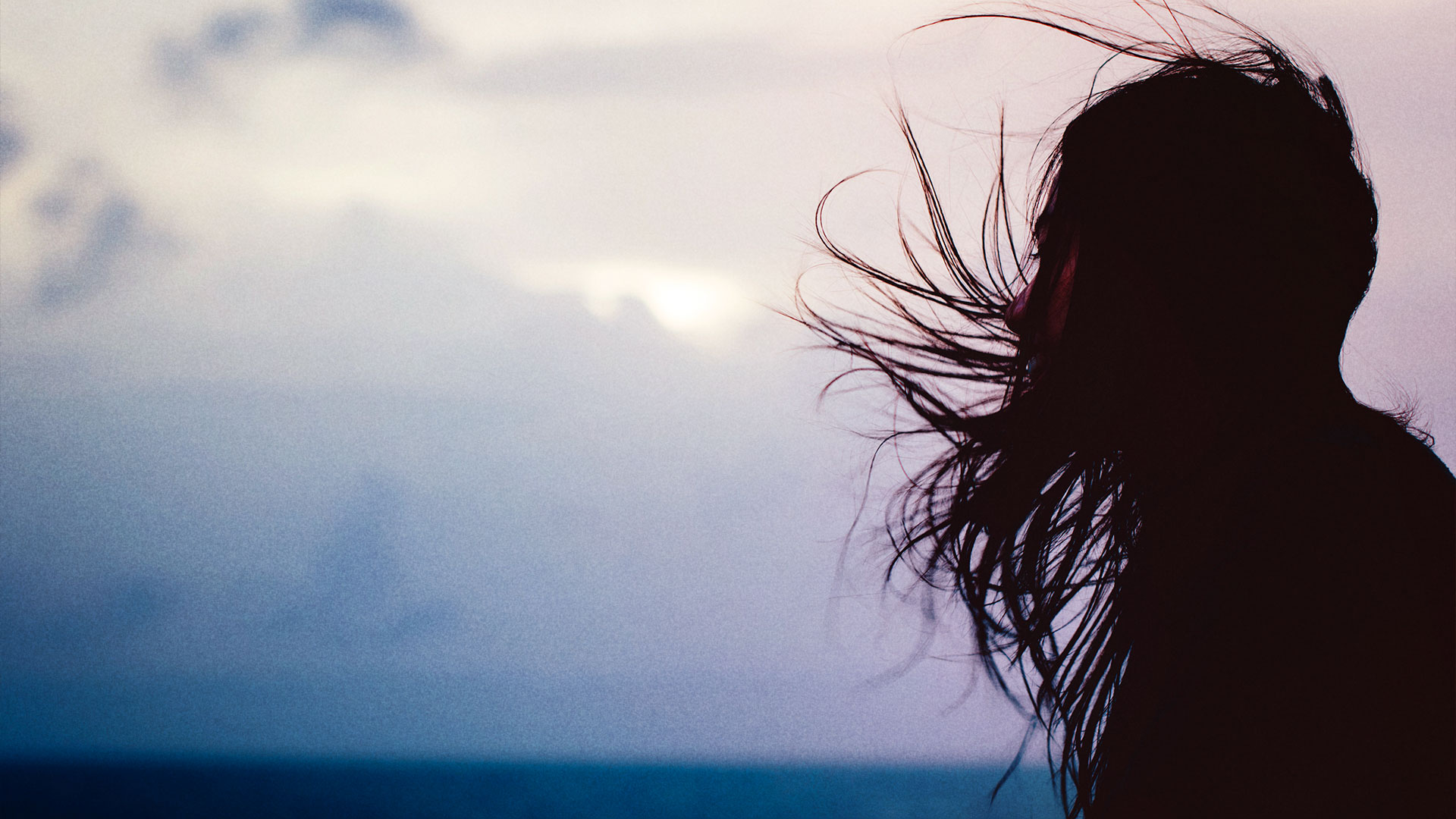 Girl with hair blowing in wind