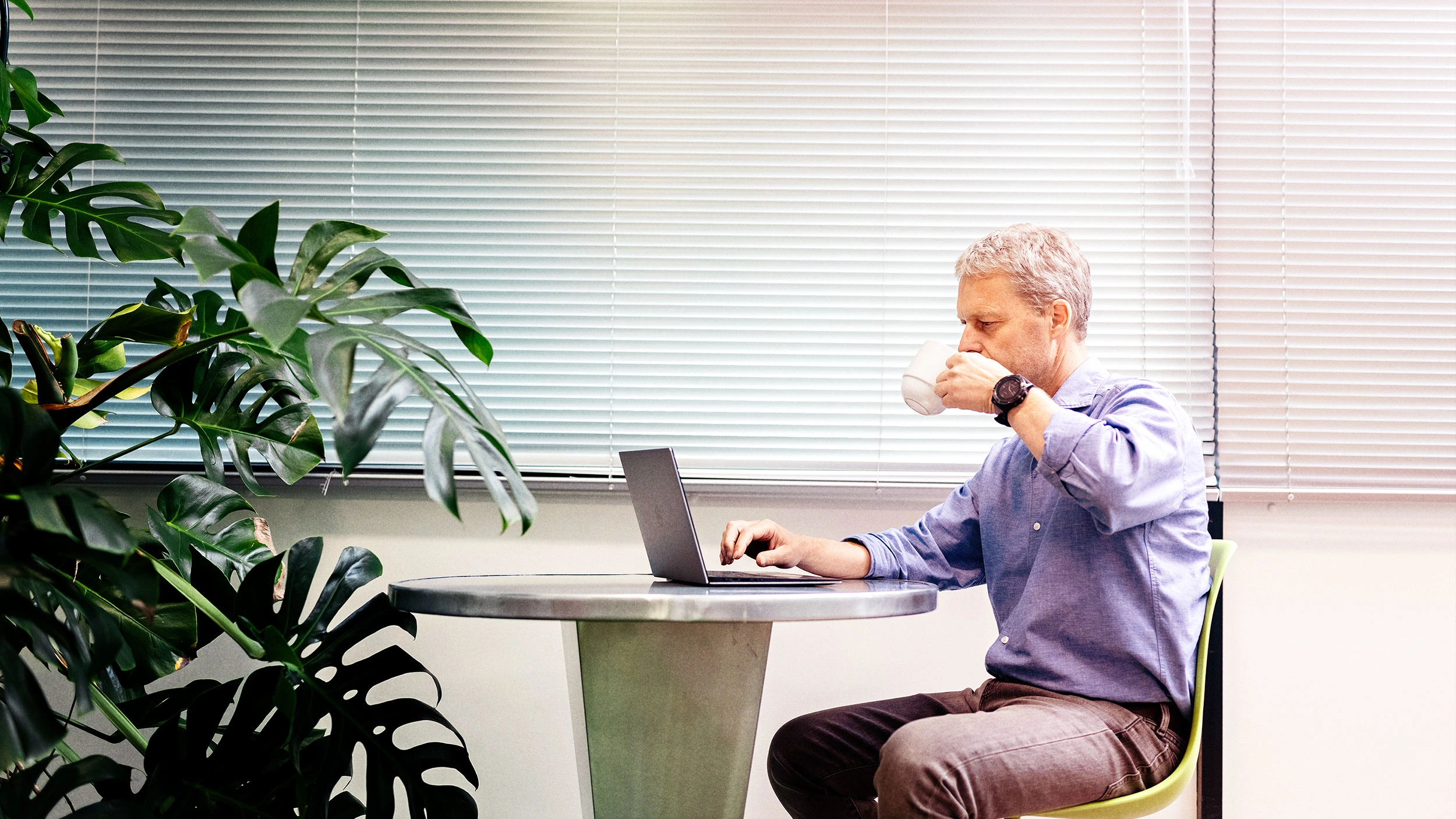 IWF staff member drinking coffee