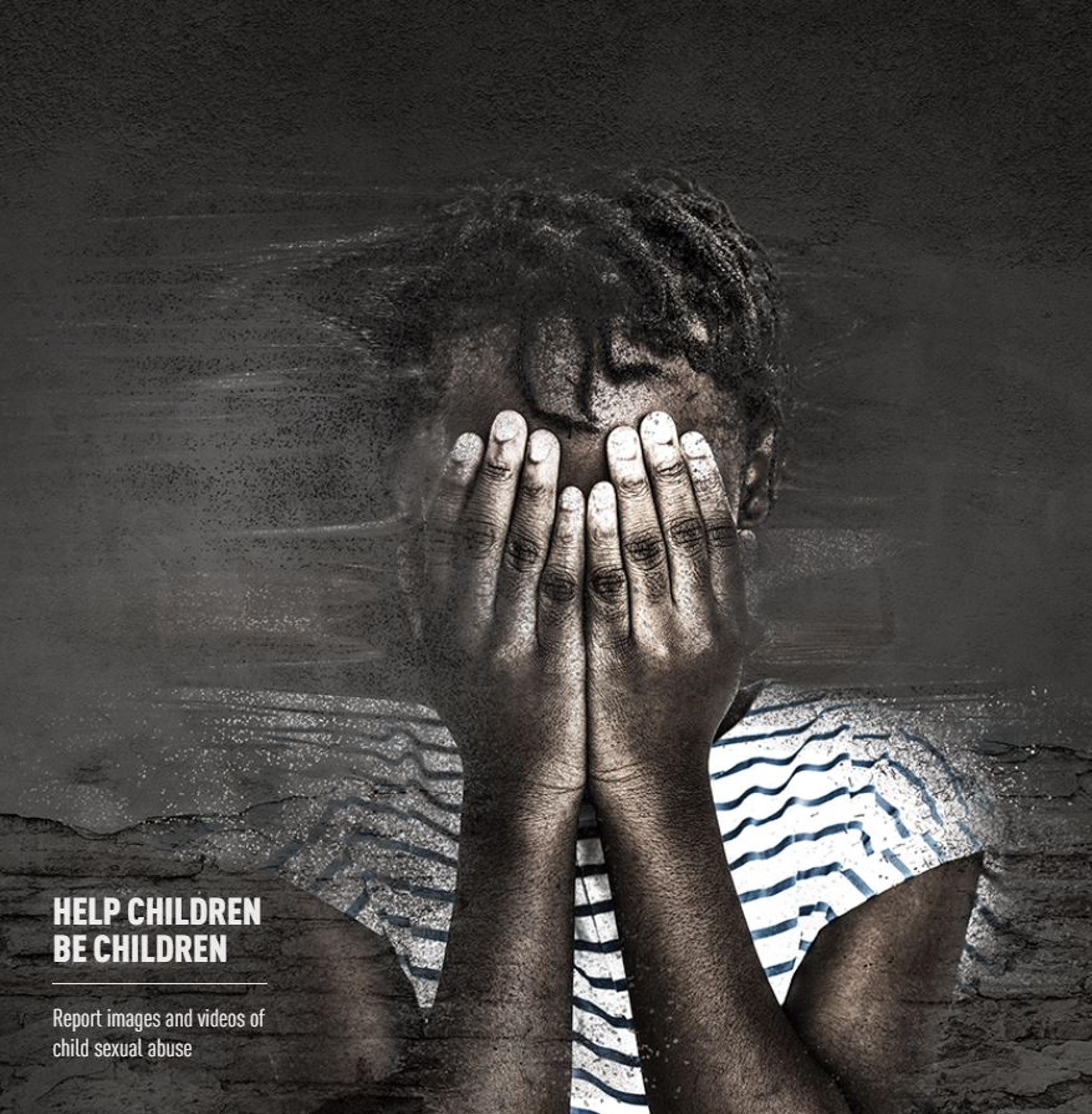 Child crying covering face with hands