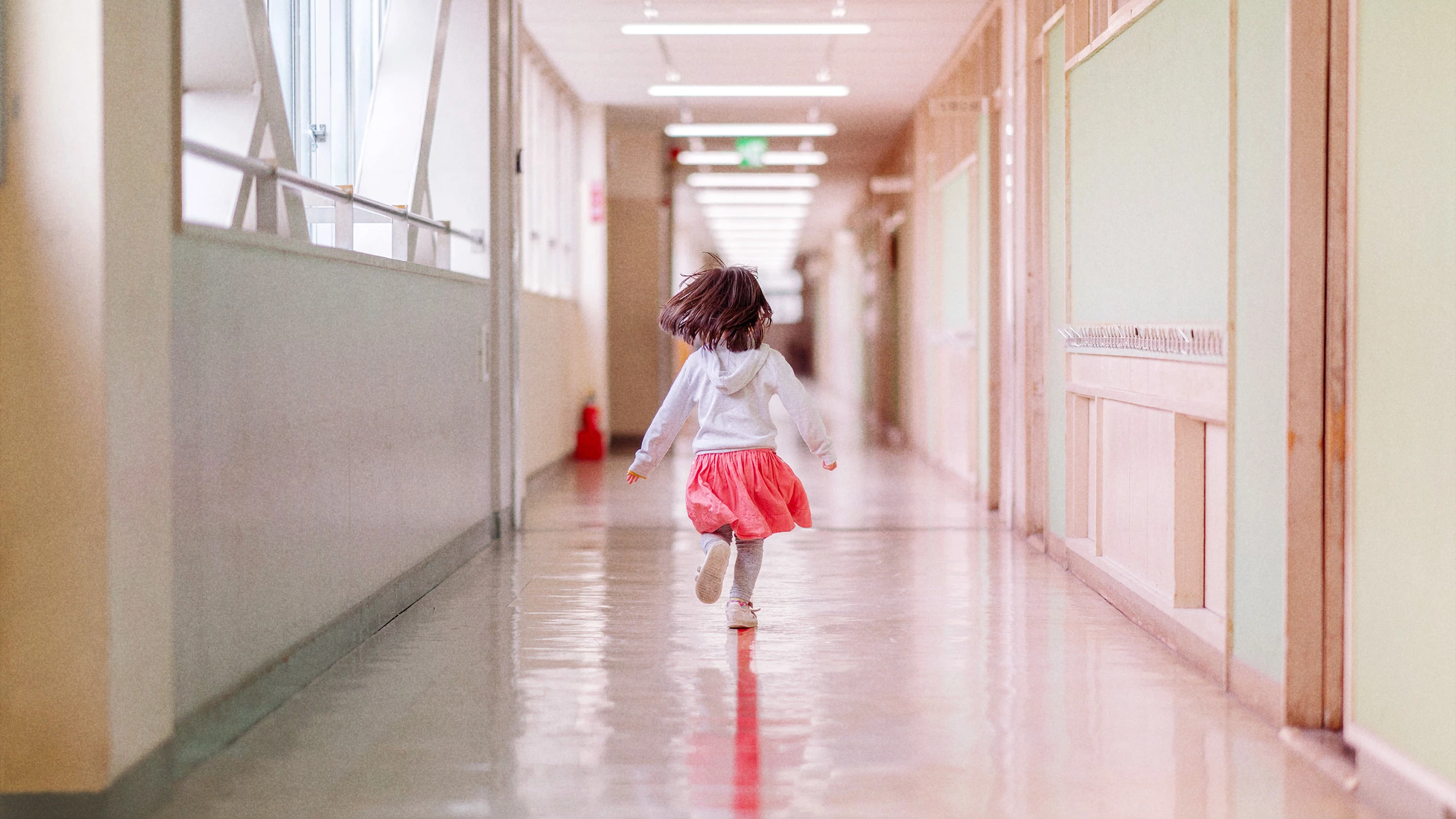 Child running down corridor