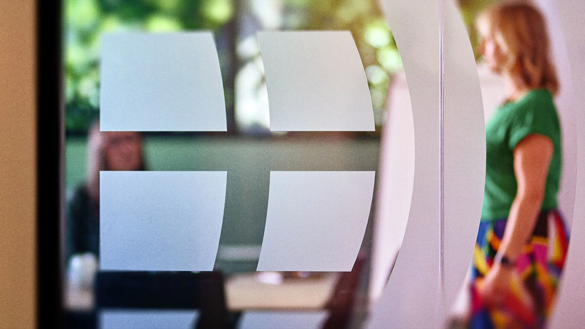 IWF globe on glass with people (out of focus) behind it